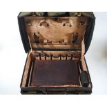 A green leather ladies dressing case with gilt initials 'V.H.