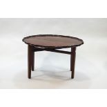 A George III style mahogany coaching table with piecrust edge to the top, on square tapering legs,