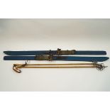 A pair of vintage painted wooden skis and poles,