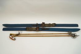 A pair of vintage painted wooden skis and poles,