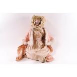 A Victorian porcelain doll, probably French, with bisque head and neck,