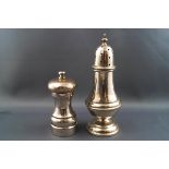 A silver sugar caster, of baluster form with flared weighted foot, 16cm high,