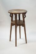 An Arts and Crafts oak two tier occasional table,