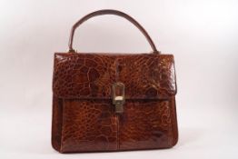 A 1940s/50s crocodile skin handbag, 26cm wide,