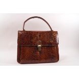 A 1940s/50s crocodile skin handbag, 26cm wide,