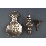 A silver caddy spoon embossed with tavern figures in the Dutch Style, London import marks 1968,