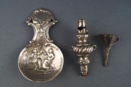 A silver caddy spoon embossed with tavern figures in the Dutch Style, London import marks 1968,