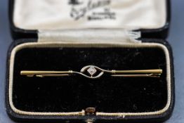 A stamped 15 carat bar brooch in fitted case,