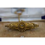 A Victorian 15 carat gold brooch, in case.