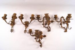 A pair of gilt metal wall two branch candle sconces,