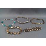 A selection of five abstract silver bracelets. Each stamped 925. Total Gross weight: 61.