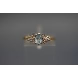 A hallmarked 18 carat gold dress ring set with aquamarine and diamonds. Gross weight; 2.