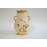 A Minton porcelain two handled vase with prolific gilt decoration of plants to one side,