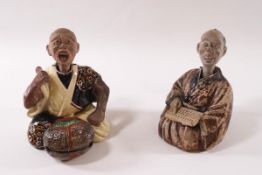 A pair of 19th century Chinese terracotta nodding figures of seated musicians,
