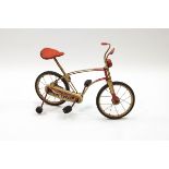 A mid-20th century Mobo Tot-Cycle with stabilisers,