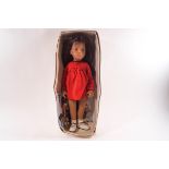 A Trendon Sasha brunette doll, No 104, with red dress,