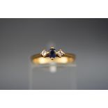 A hallmarked 18ct gold ring set with an oval sapphire measuring 3.6mm x 3.
