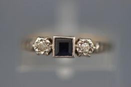 An early 20th century gold, sapphire and diamond three stone ring,