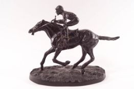 A 20th century bronze of a racing jockey,