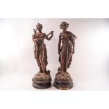 A pair of Spelter figures of Classical maidens titled Duo & Idylle with 1912 presentation plaque to
