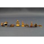 A selection of yellow gold charms consisting of the following: Bristol shield,
