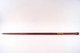 A locust wood walking cane with turned knop