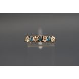 A seven stone ring set with blue topaz and diamonds, hallmarked 9ct, London, stamped 'DIA', 2.