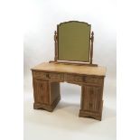A limed oak crown bedroom suite comprising a wardrobe, chest of drawers, dressing table,