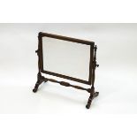 A late Victorian oak dressing table swing mirror,