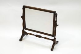 A late Victorian oak dressing table swing mirror,