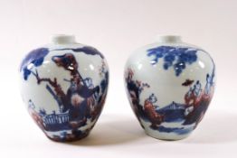 A near pair of Chinese porcelain squat baluster vases,