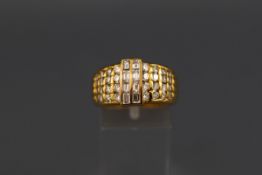 A yellow metal ring set with eight baguette cut diamonds measuring approximately 3.00mm x 2.