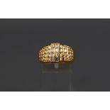 A yellow metal ring set with eight baguette cut diamonds measuring approximately 3.00mm x 2.