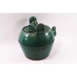 A Chinese stoneware teapot and cover of globular form with green glaze,