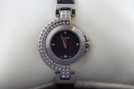 A ladies Pulsar wristwatch with leather strap and pin buckle.