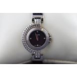 A ladies Pulsar wristwatch with leather strap and pin buckle.