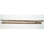 Three wooden hiking staffs,