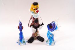 A Murano glass figure of a clown, 22cm high, and a pair of blue glass fish,
