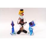 A Murano glass figure of a clown, 22cm high, and a pair of blue glass fish,