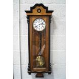 A 20th century Vienna regulator clock with ebonised and burr wood case, pendulum and single weight,