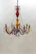 An eight branch chandelier with moulded multi coloured glass and acrylic drops,