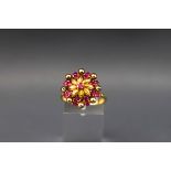 A Continental ruby flower-head cluster ring,