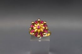 A Continental ruby flower-head cluster ring,