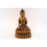 A 19th century gilt metal Nepalese Buddha, the head with pointed ushnisha and framed by long ears,