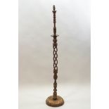A Middle Eastern turned wood standard lamp with bone flower and line inlay decoration,