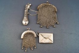 Two mesh metal purses, a stamp holder in the form of an envelope,