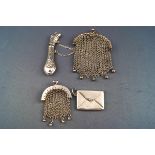 Two mesh metal purses, a stamp holder in the form of an envelope,