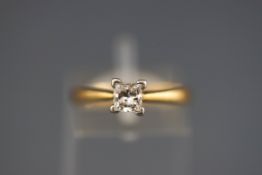 A hallmarked 18ct gold single stone ring set with a princess cut diamond measuring approximately 4.