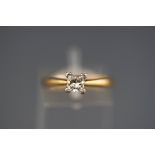 A hallmarked 18ct gold single stone ring set with a princess cut diamond measuring approximately 4.