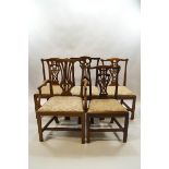 A harlequin set of five George III mahogany chairs,